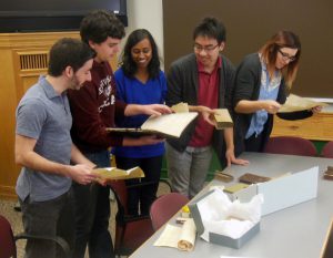 Undergraduates in my European Civilization course doing a hands-on session with antique books from the 14th through 18th Centuries